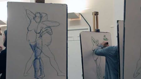Someone sketching a body at a life drawing class