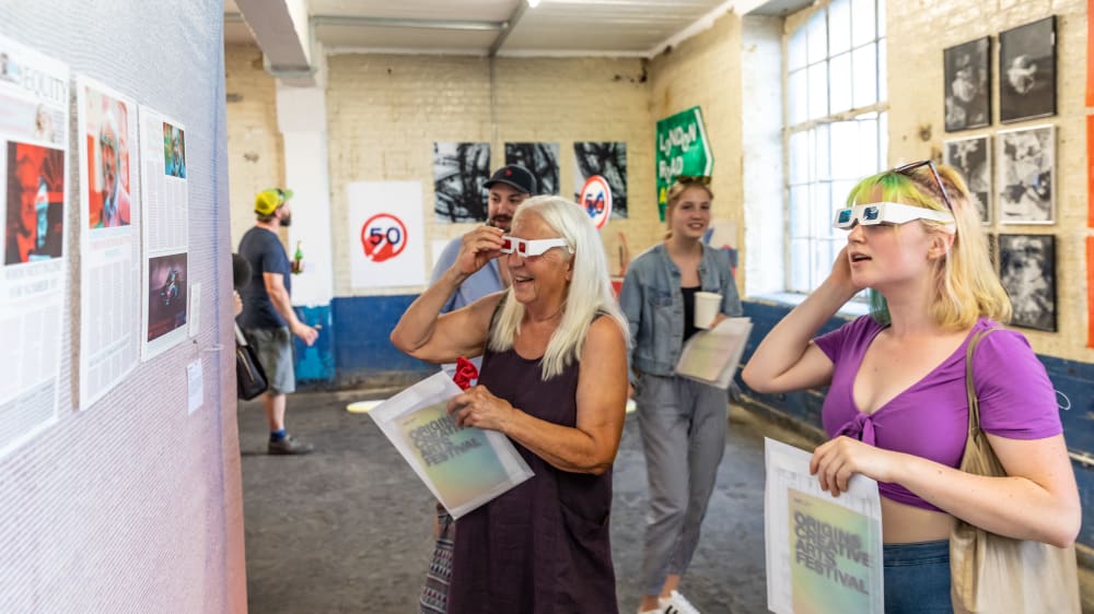 People engaging with artwork at Origins Creative Arts Festival 2019