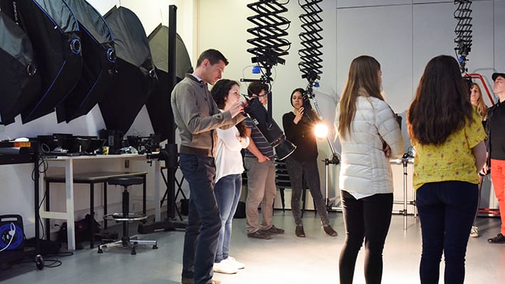A group of people in a photography studio
