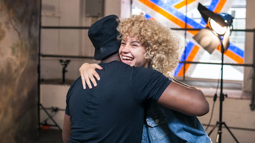 Students hugging on a photo shoot