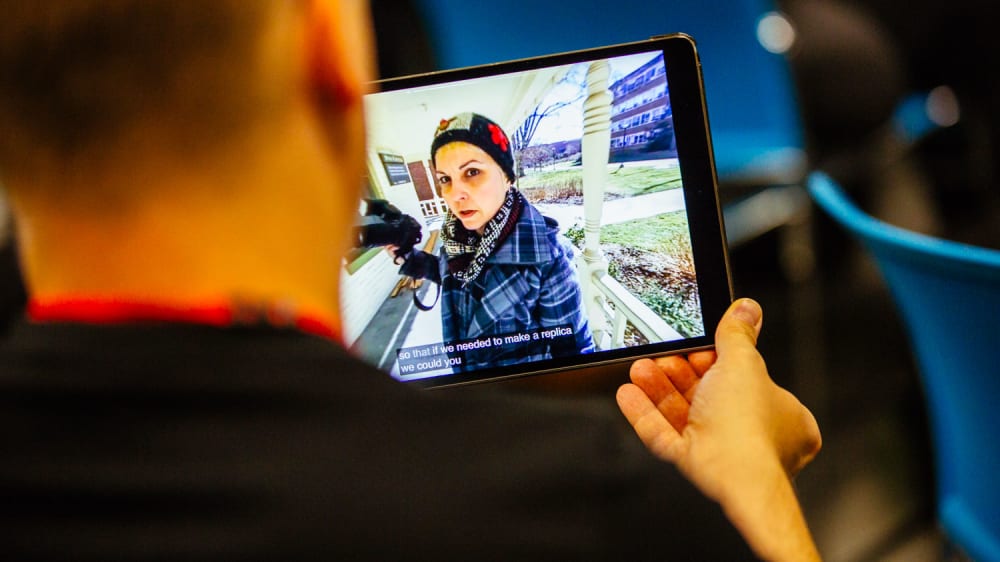 Woman holding videocamera
