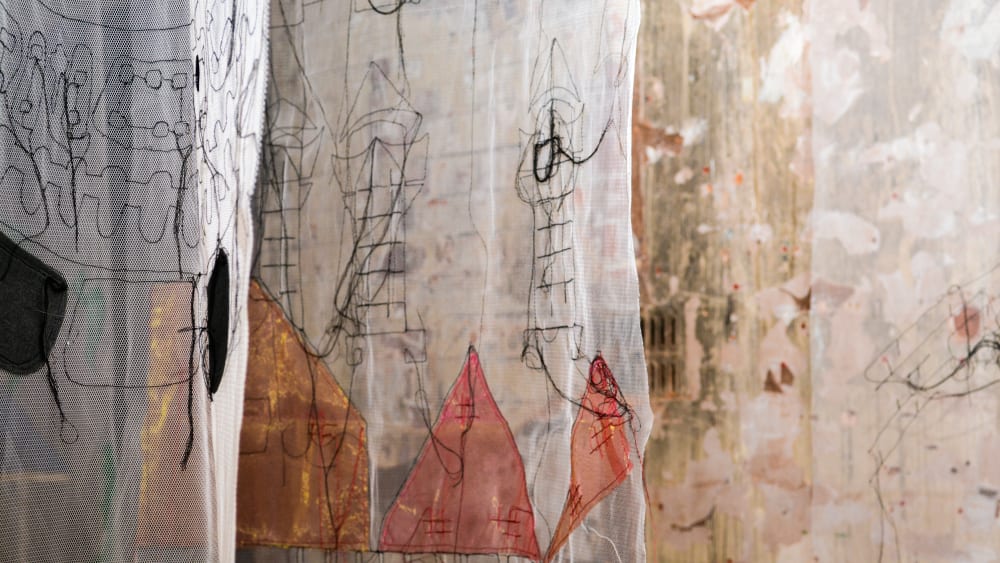 Hanging colourful embroidered fabrics