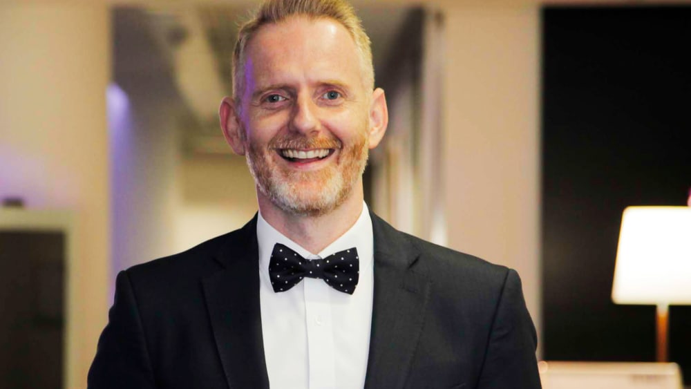 Man in suit smiling