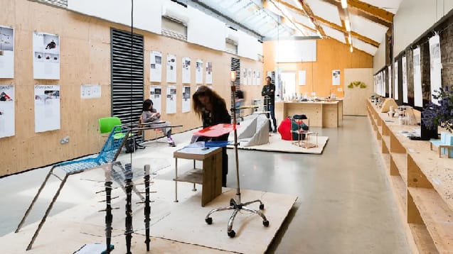 People in studio look at foundation degree show work