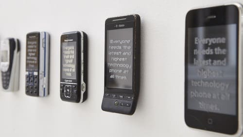 Photo of mobile phone installation on wall at degree show
