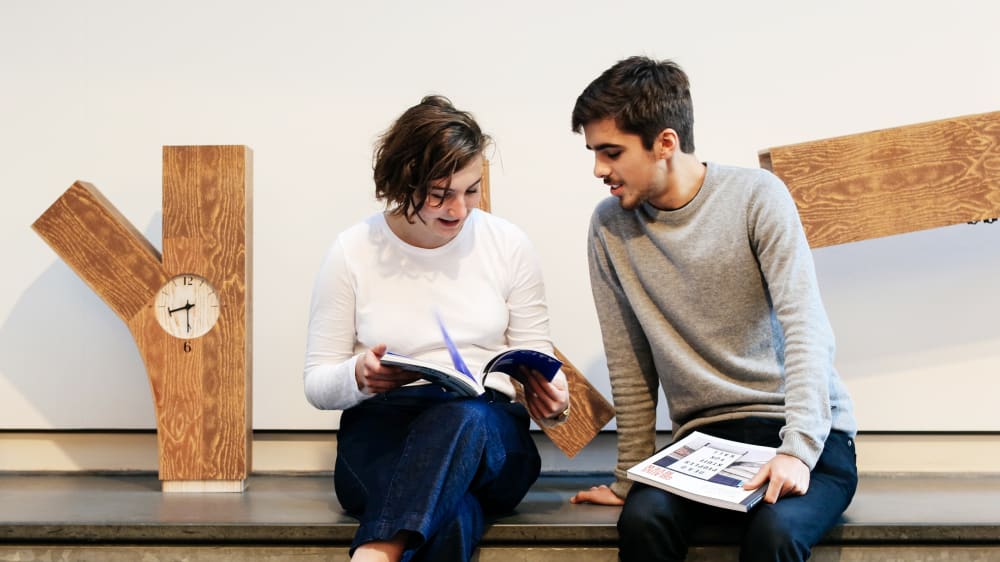 Students discussing their work