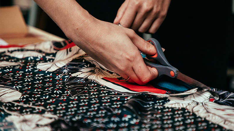 Close up of fabric being cut