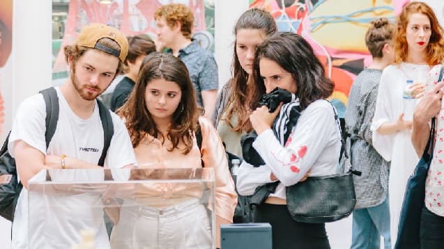 people look at glass exhibiting case