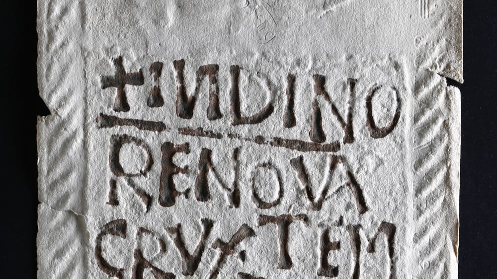 Letters carved int oa stone tablet