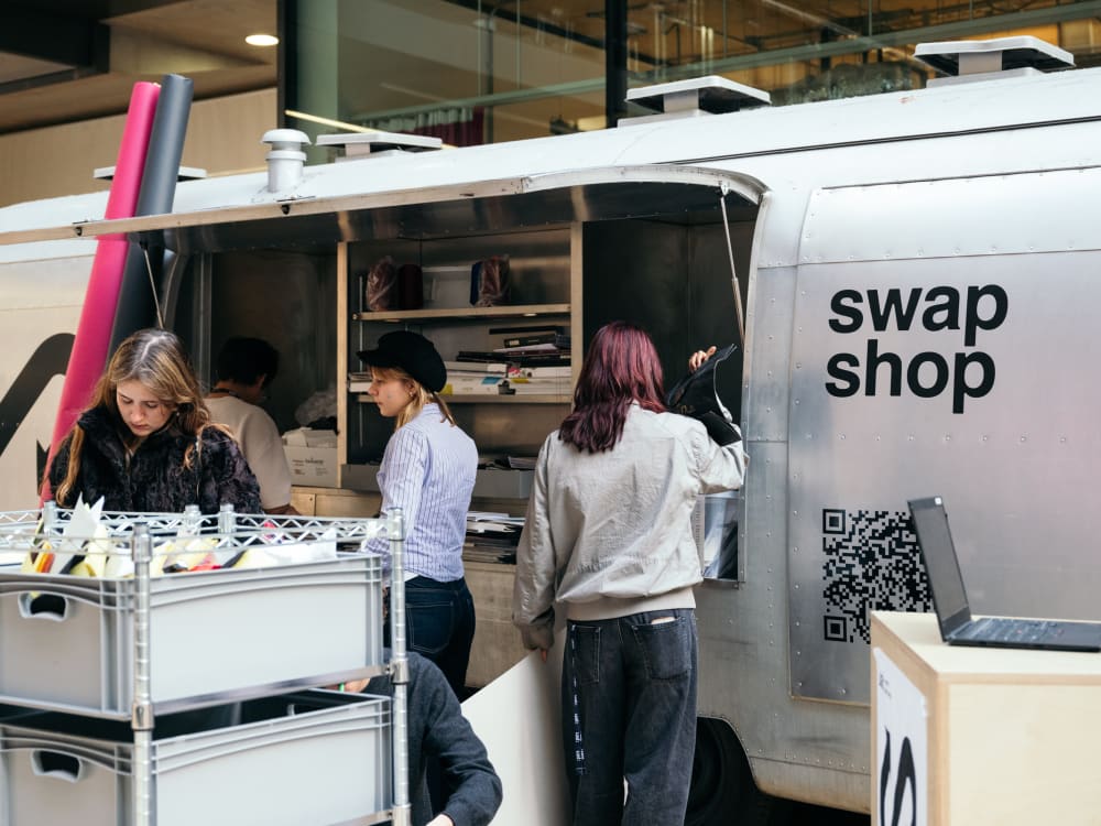 People browse items at a mobile 