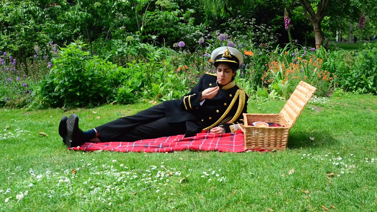 Photograph of performance in park with person in military uniform eating a picnic by Veera Rustomji - MA Fine Art.