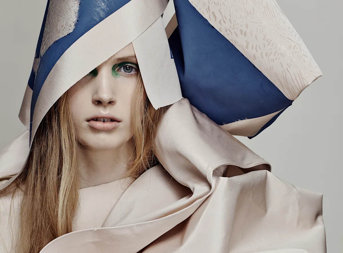 Female model in cream and blue material.