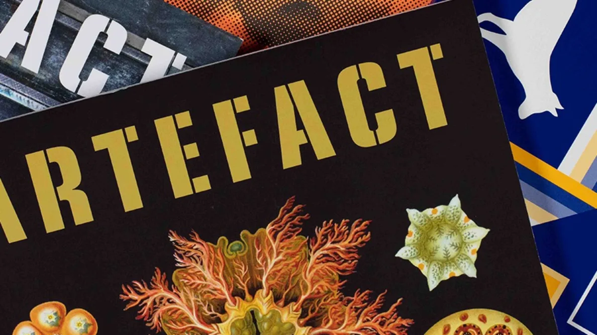 A fan of magazines covers shot against a white background.