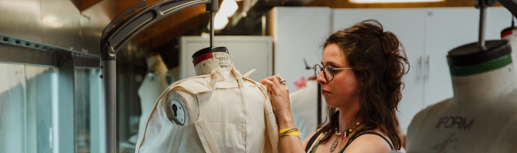 Student working on fashion mannequin