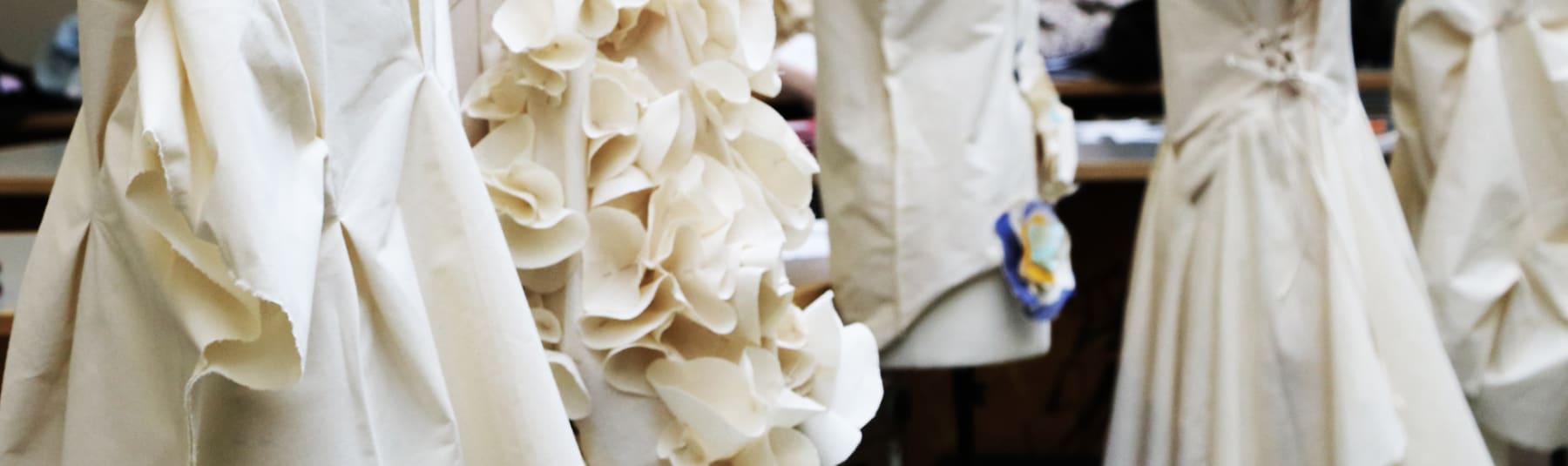 Draped material on mannequins.