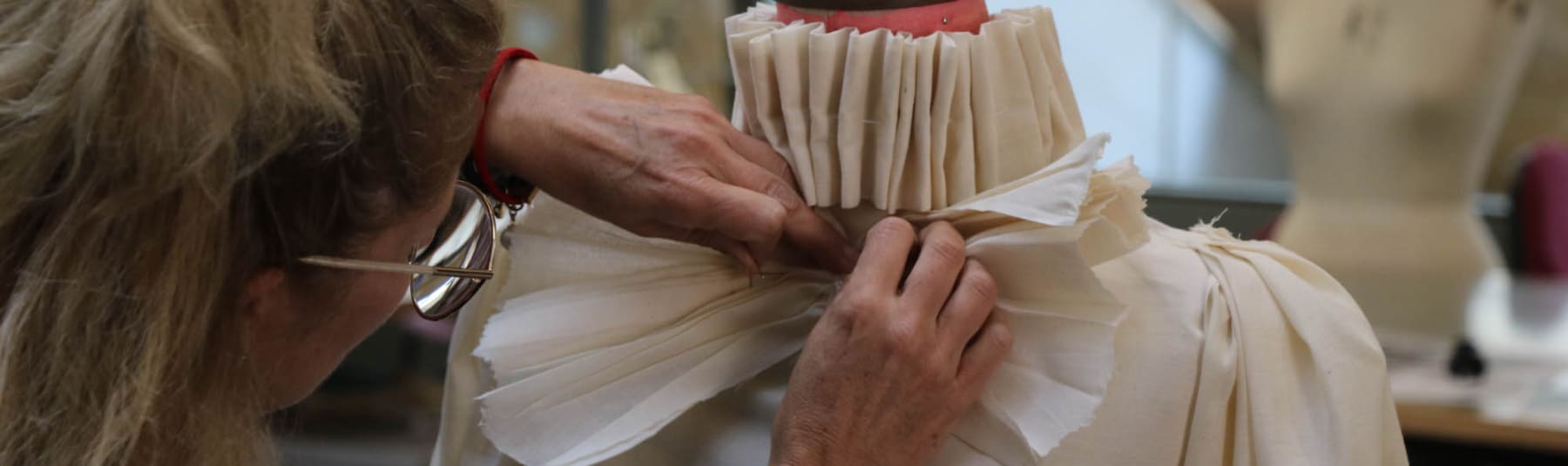 Student draping mannequin