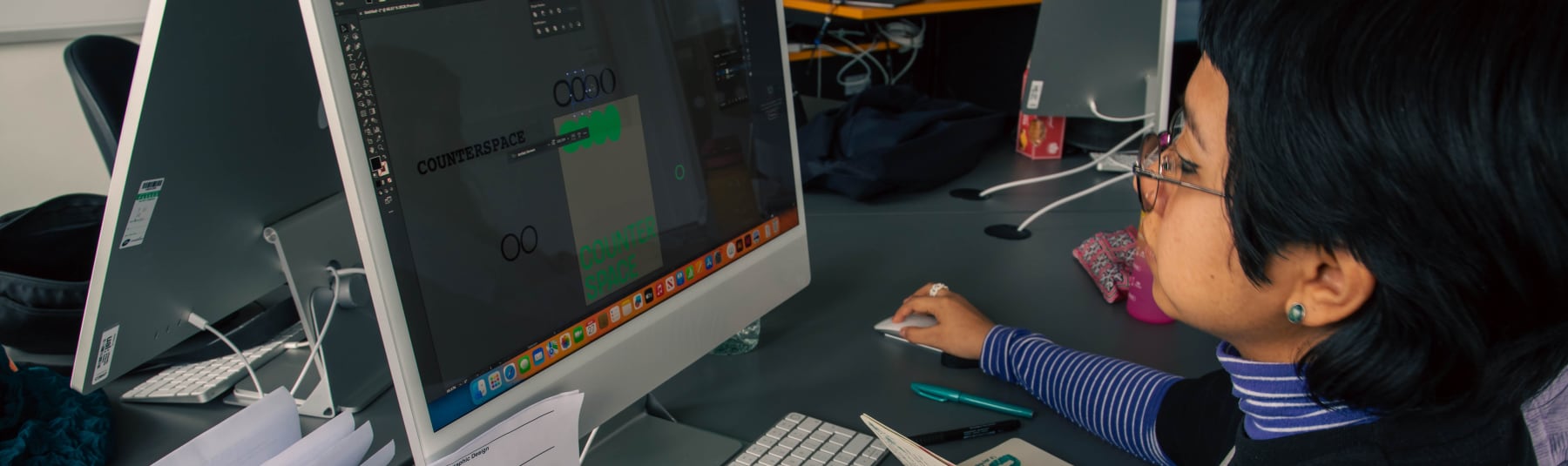 Student working off of iMac