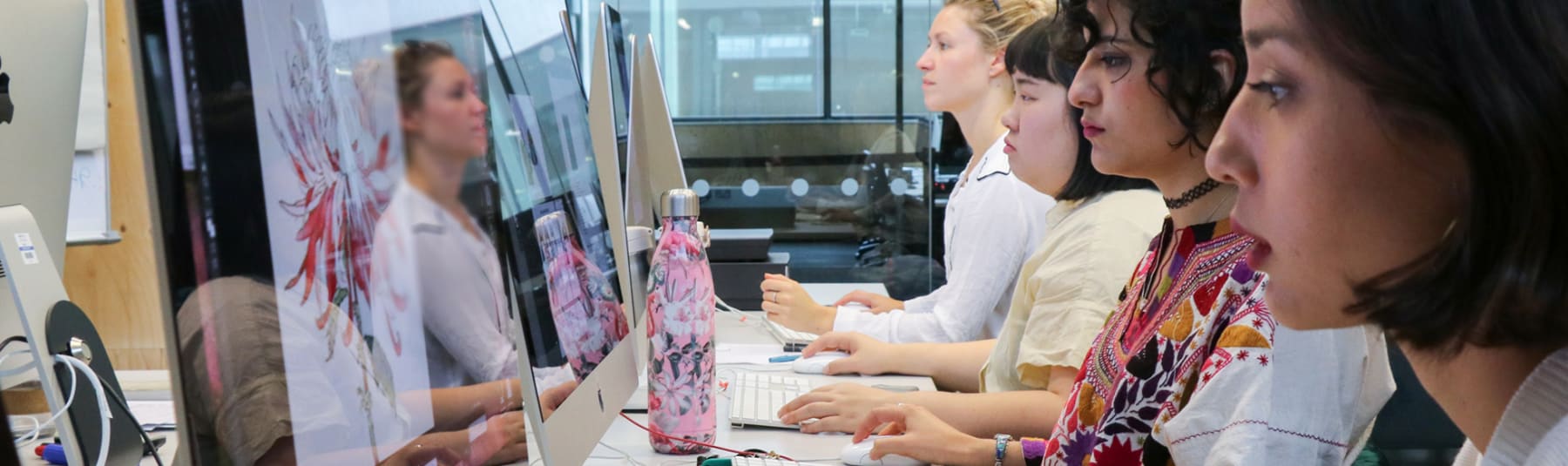 Students work at computers