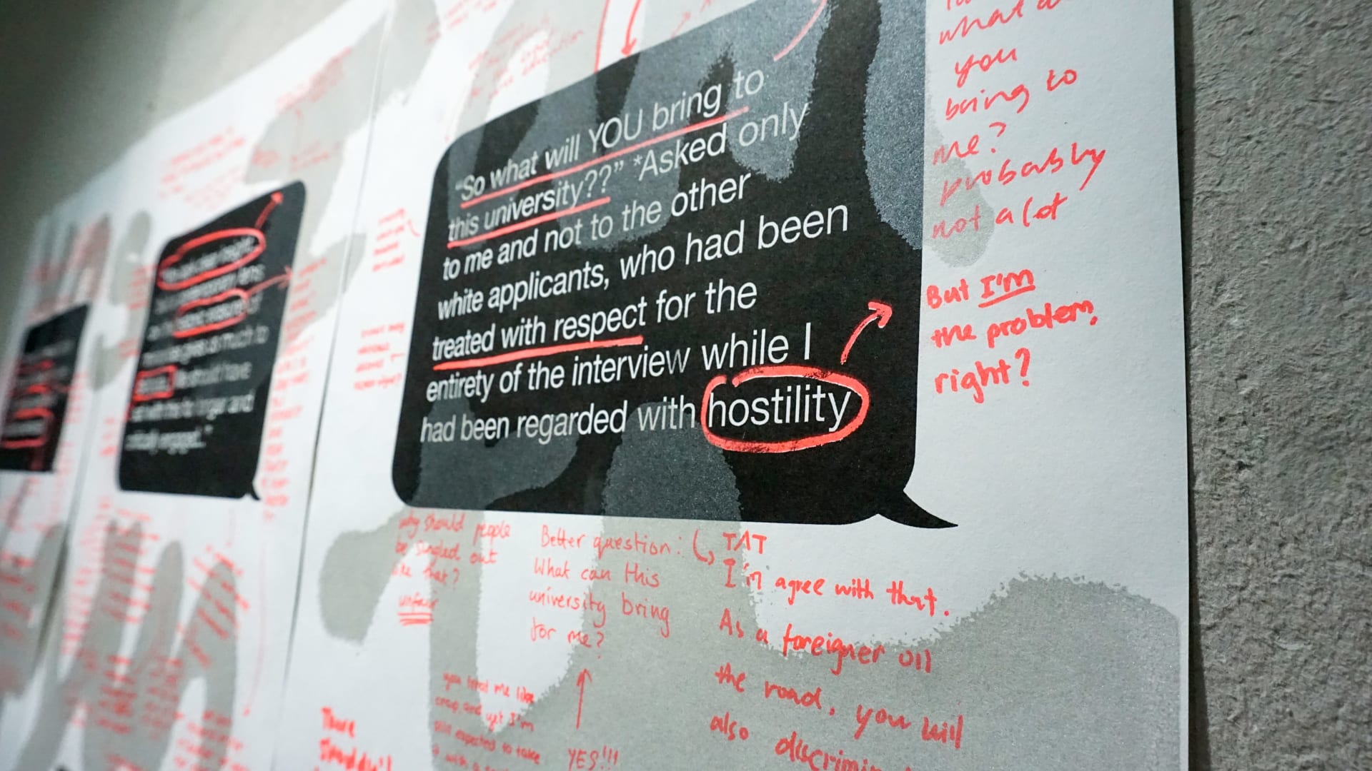 Posters with black speech bubbles and white typed text. Flourescent red handwritten text annotates the rest of the poster.