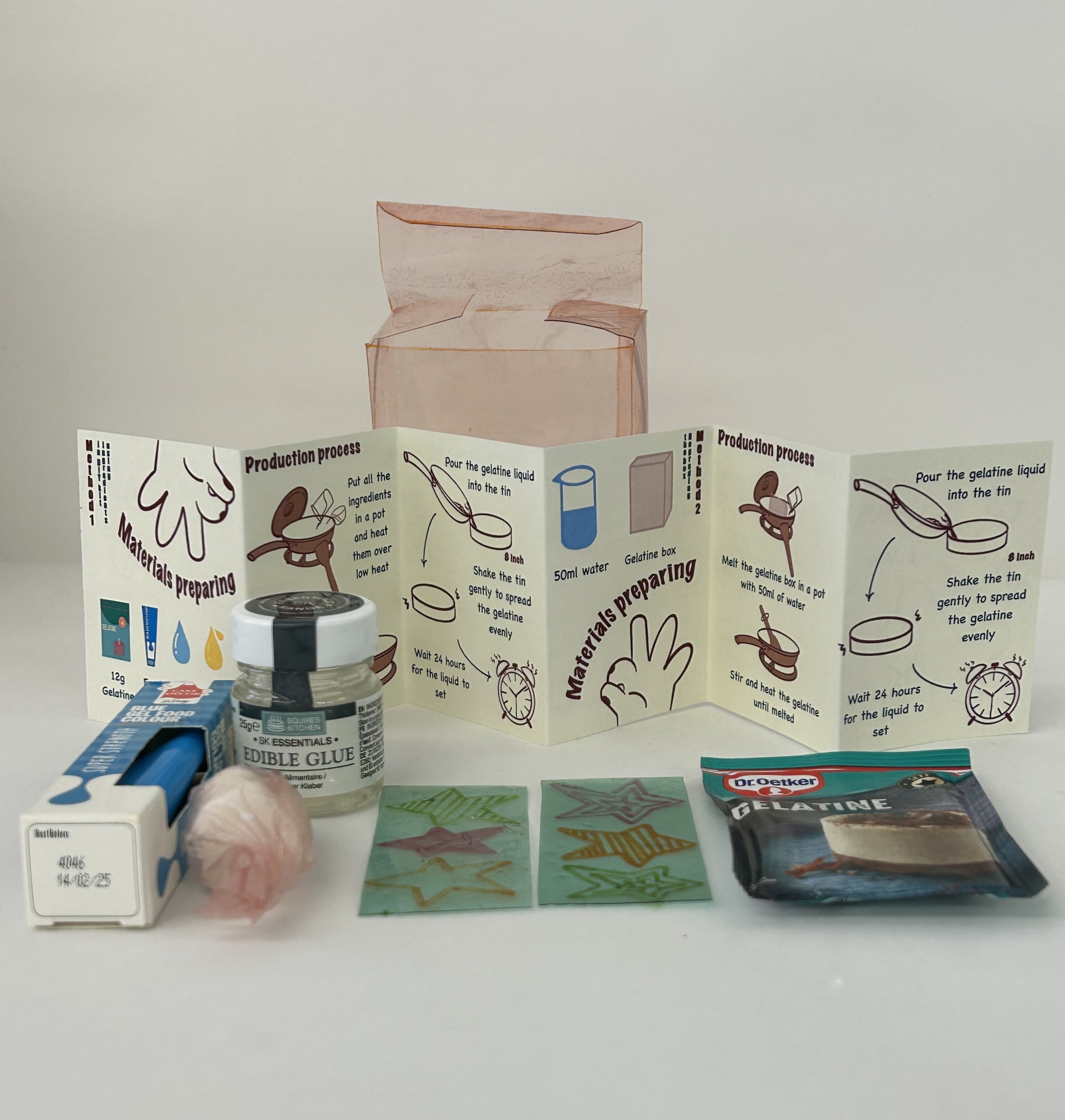 The kit includes an instruction manual, blue edible colouring, edible glue, coconut oil candles, thin strips with stars and a packet of gelatine