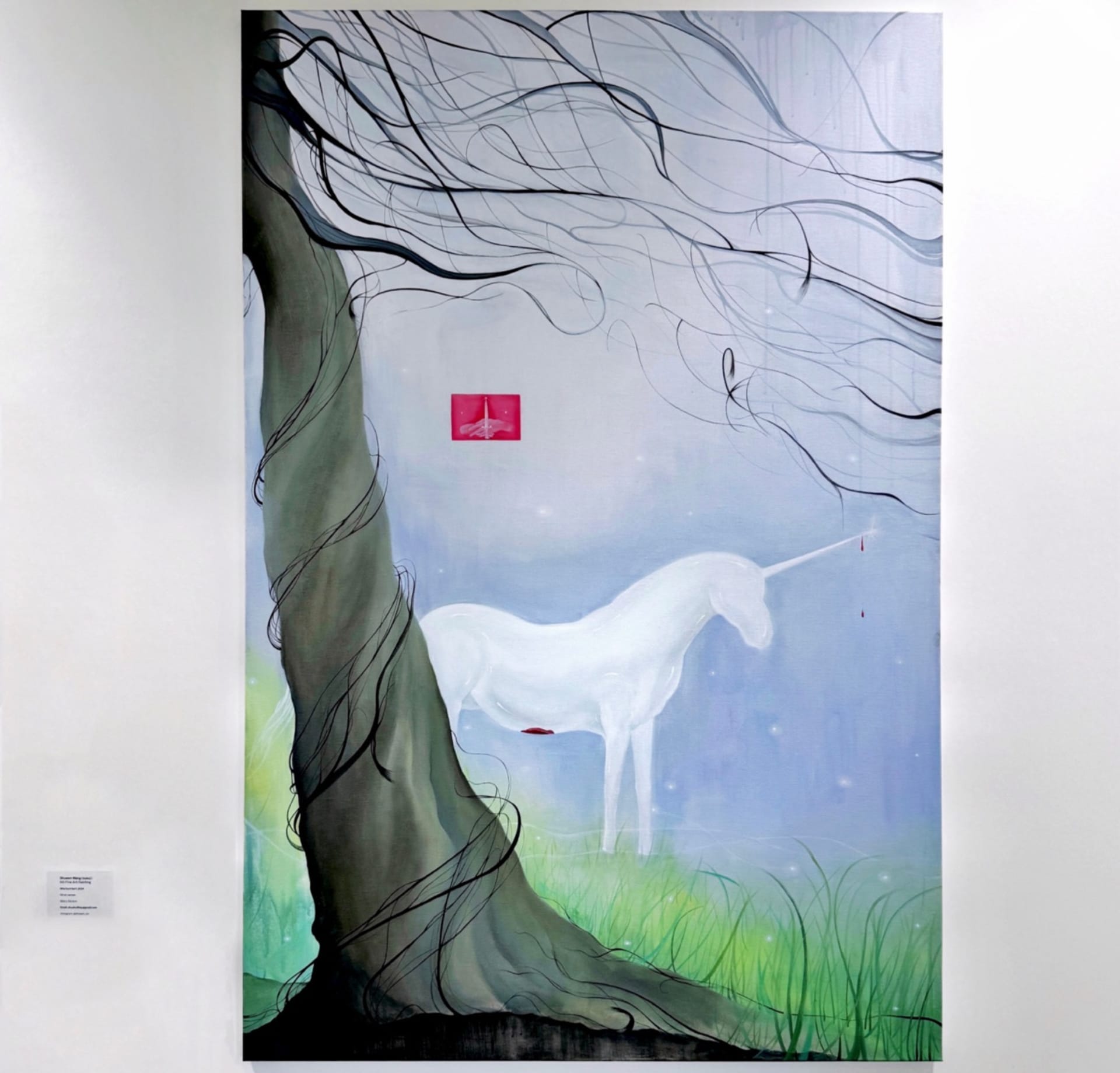 The unicorn is hidden behind a trunk made of hair, and the blood dripping from her white body is the result of her persecution as a woman in society