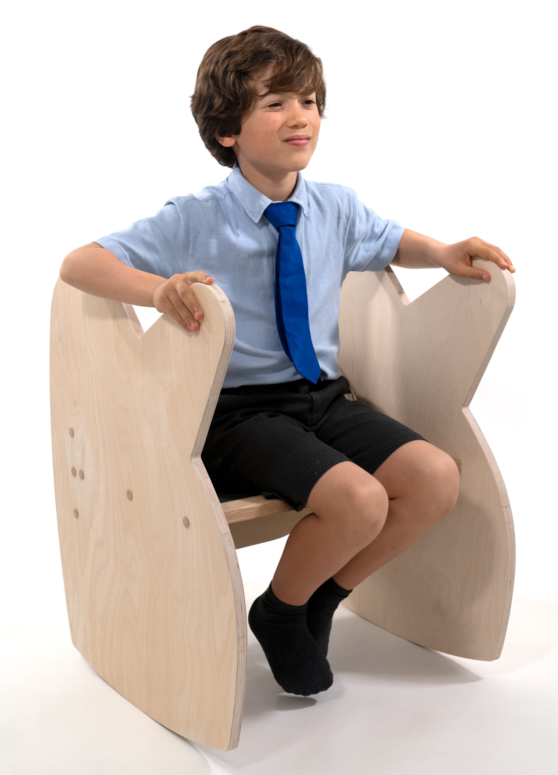 A child seated on a rocking chair