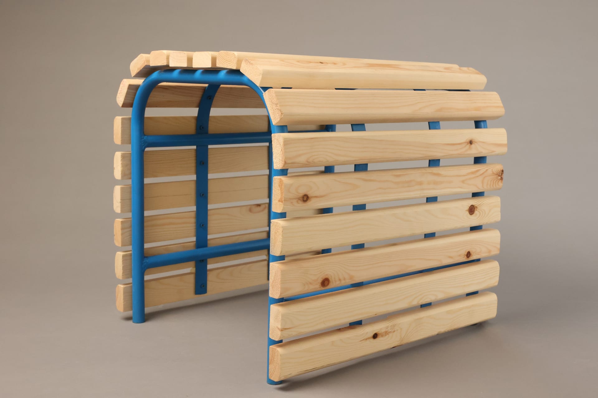image of wood planks and blue steel pipe stool, grey background