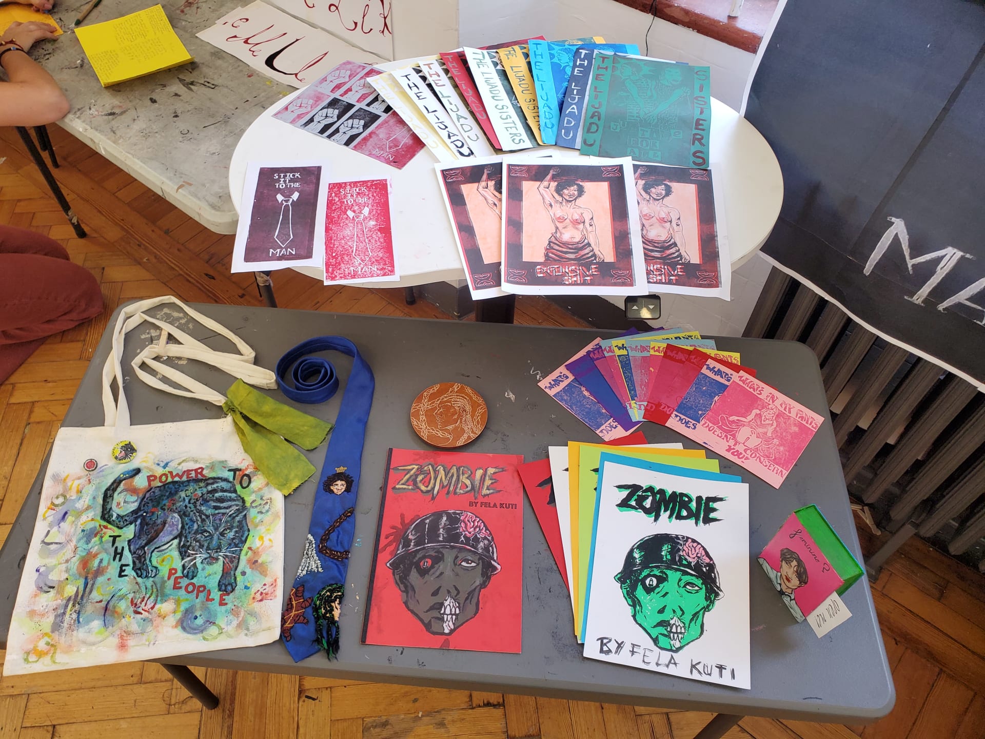 A spread of ll work create din the year, carvings, lino prints , riso prints, embroidery, a painted tote bag, screen printings and a diorama