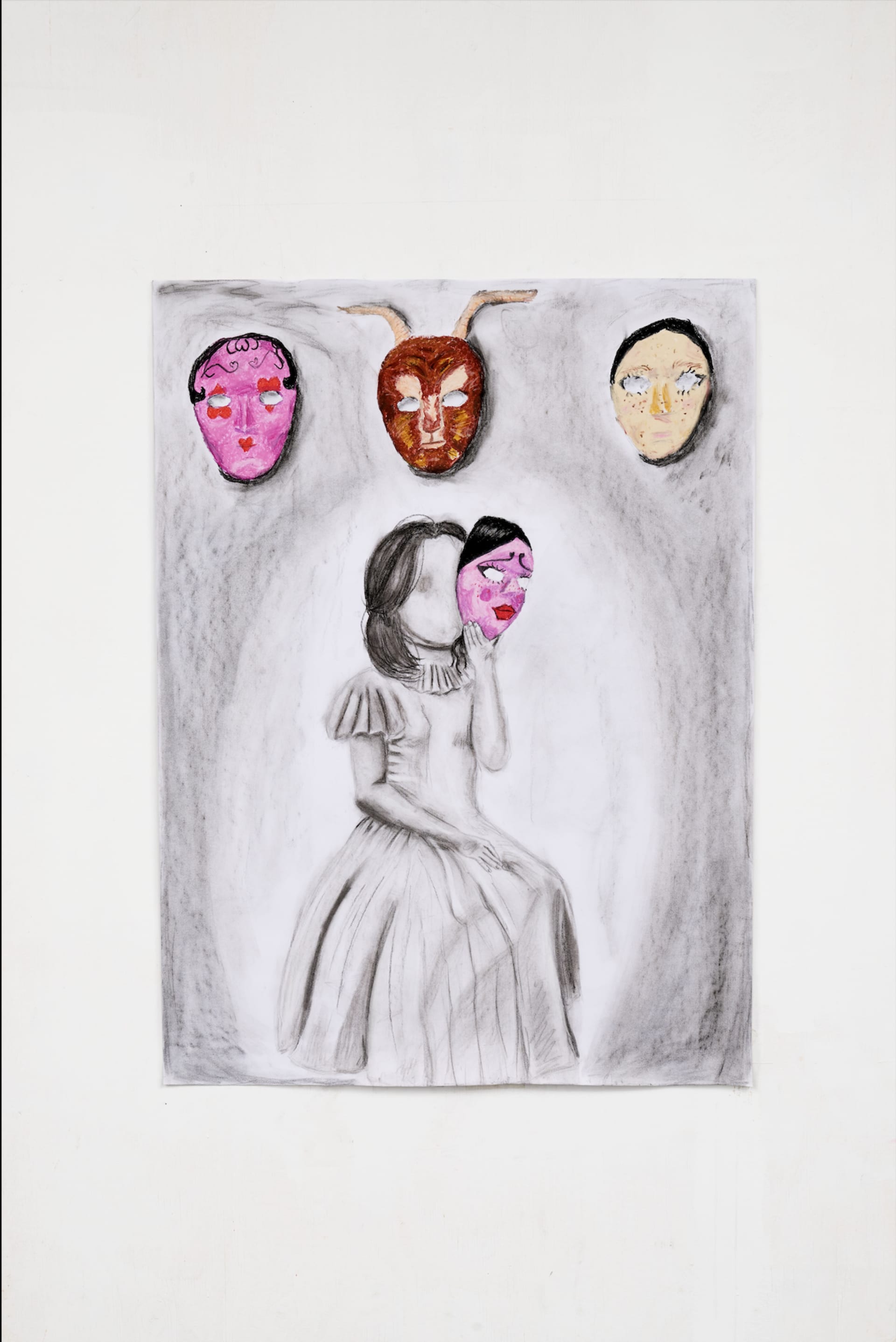 A drawing of a person with a mask. 3 other drawings of masks are laid out on top of the page.