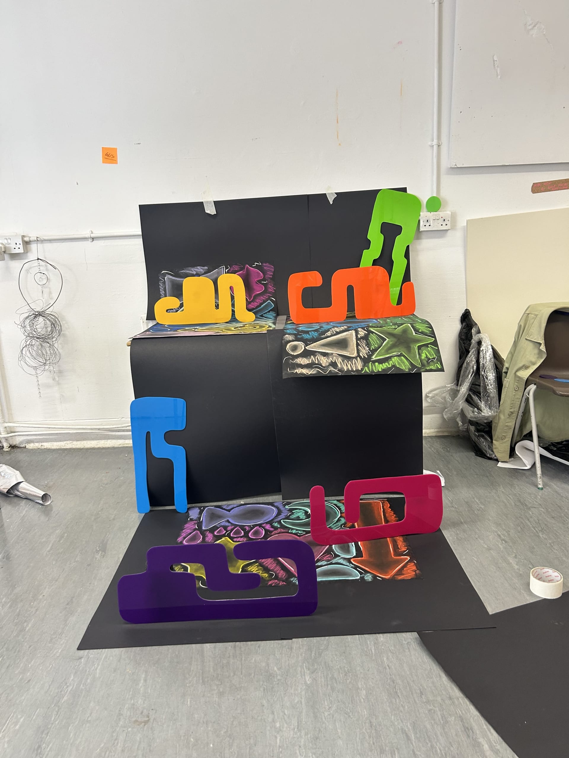 A picture of the installation being set up, mostly my process of deciding what I think works best compositionally.