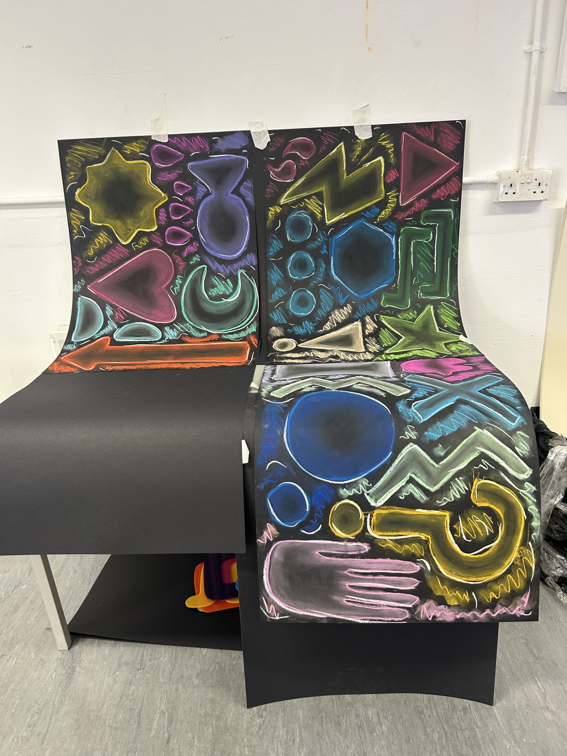 Another photograph of the set-up phase, this time with an emphasis on the background patterns and shapes.