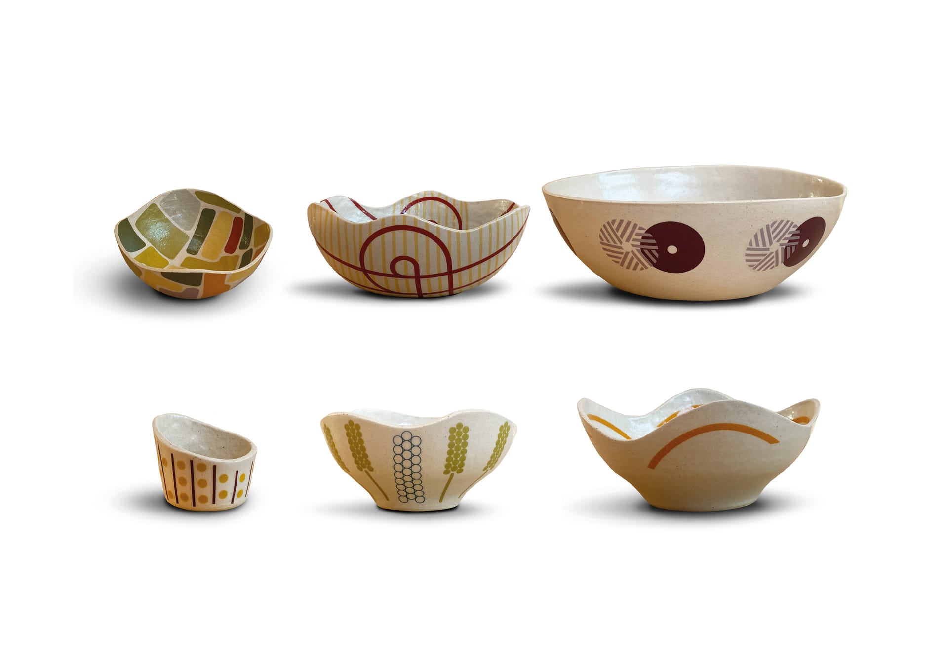 Six bowls on a white background with brighter coloured patterns.