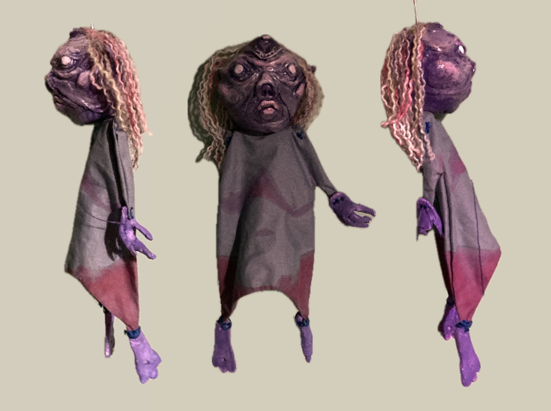 puppet of the moon imagined as an old woman photographed from different angles 