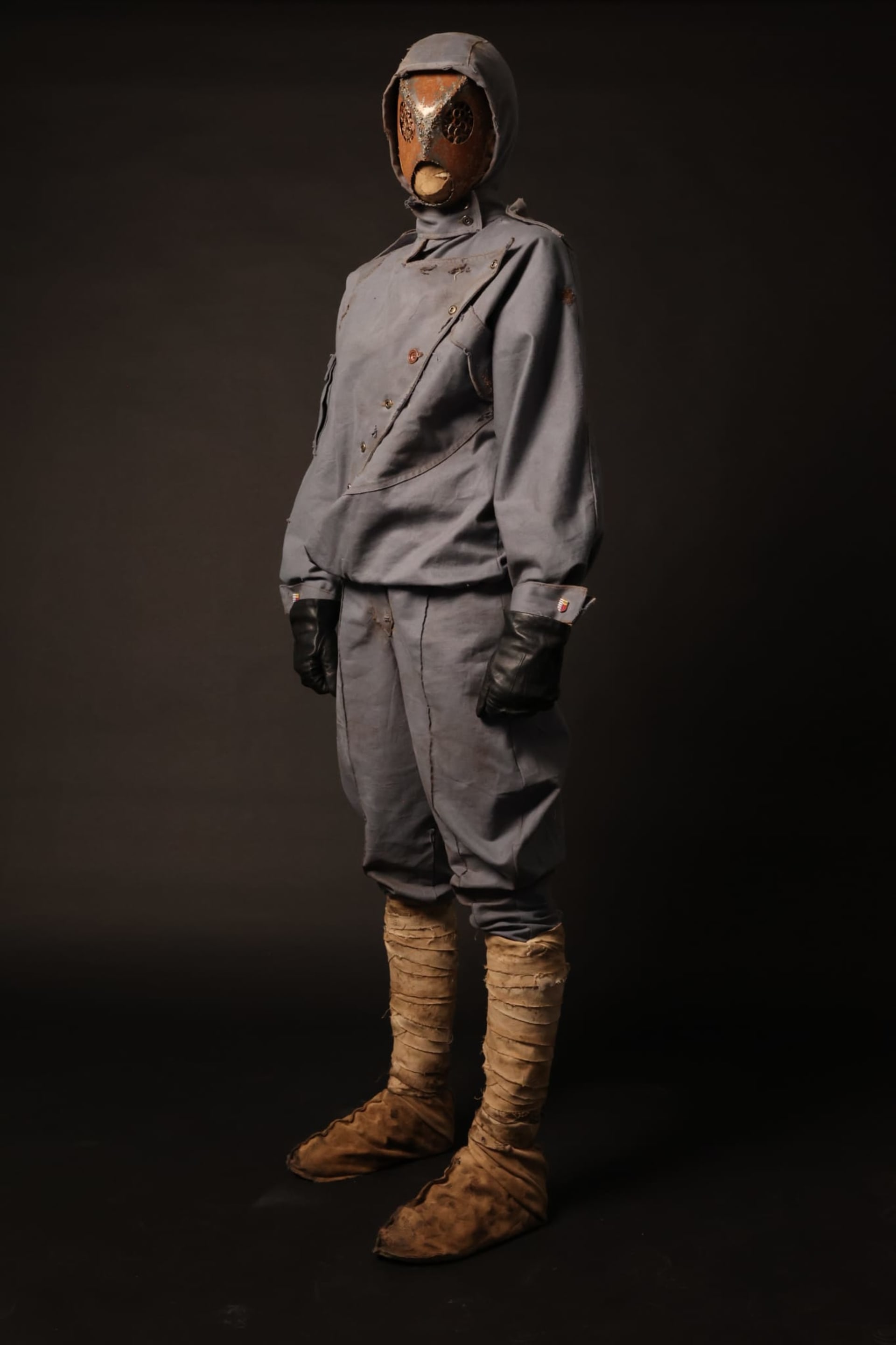3/4 shot of the full costume, a metal mask and blue-grey soldier's uniform