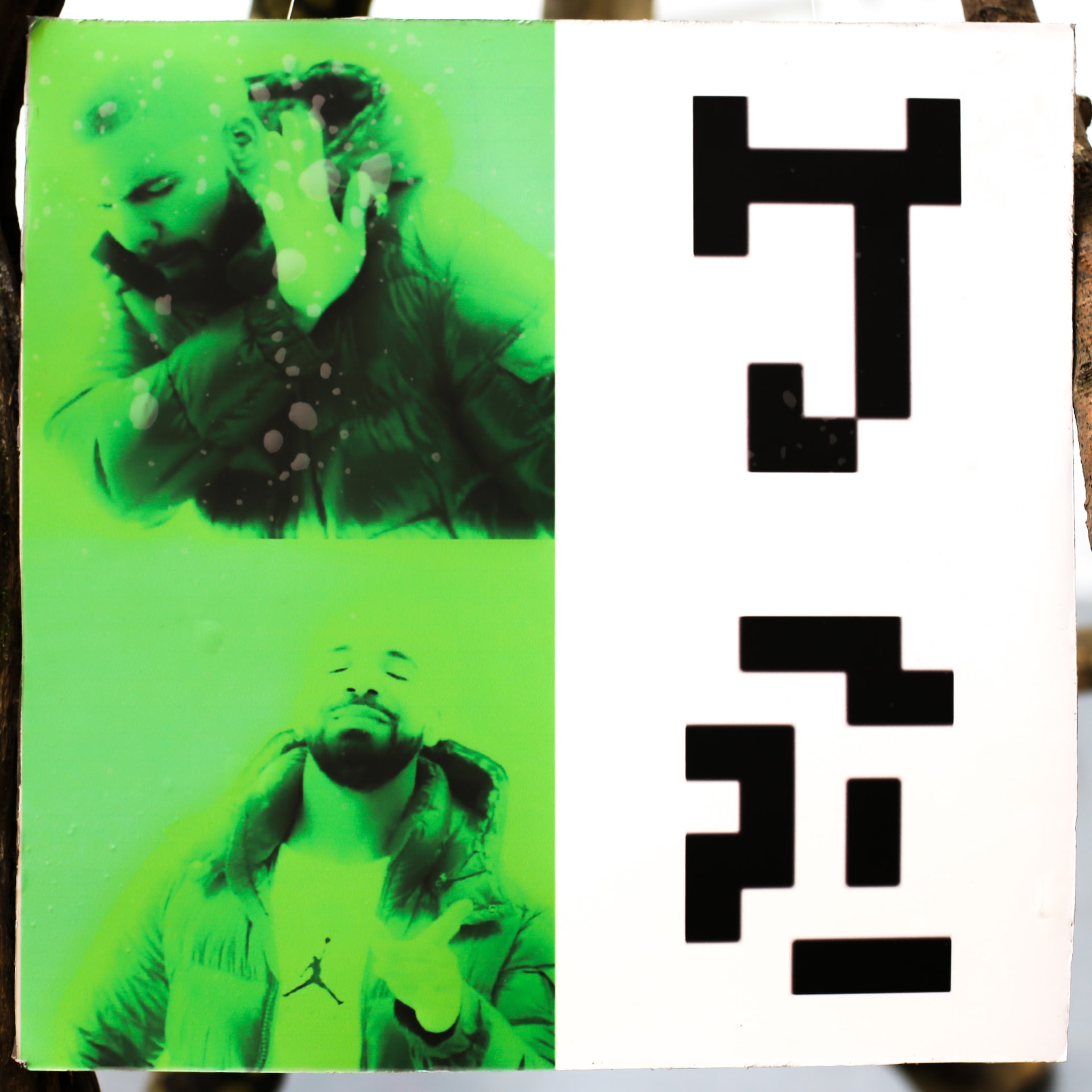 Detail showing printed image: a found meme with the 2003 alphabet from the Dutil-Dumas Message