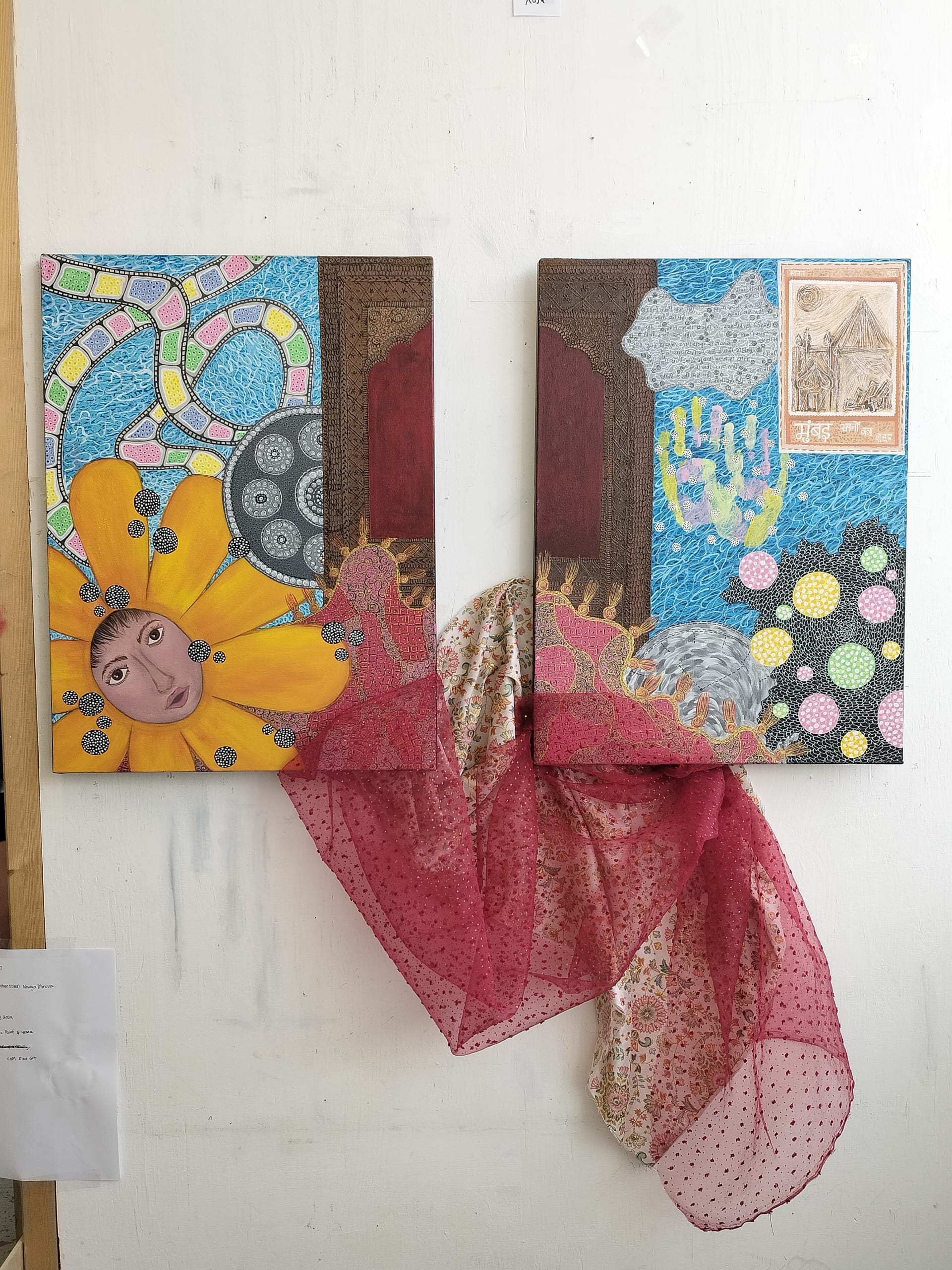 Two vibrant canvases joined by red and floral fabric feature a face in a flower, mosaic paths, handprints, and textured patterns and textiles