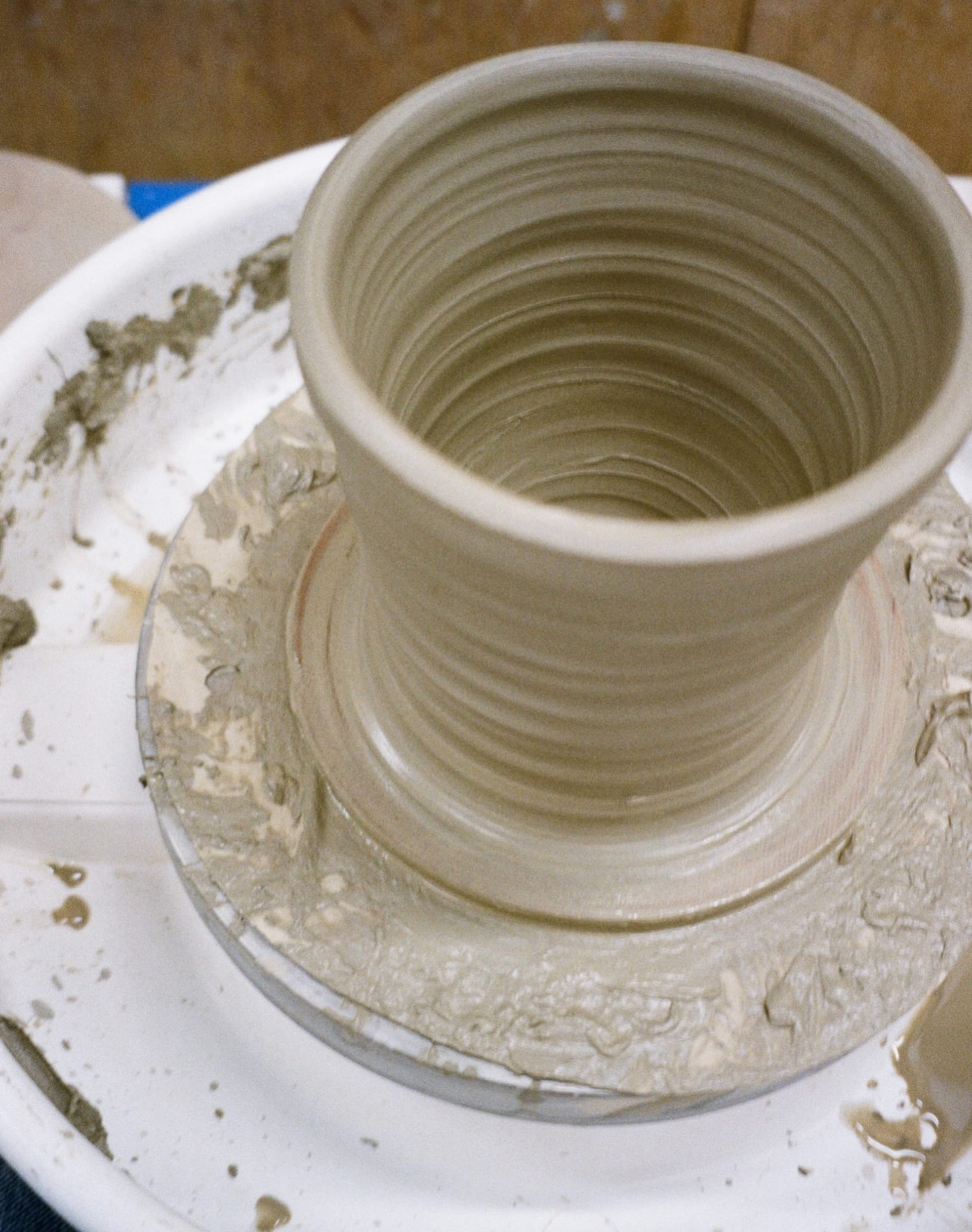 a pot that has been thrown on the wheel and is just about to be removed. 20cm wide and 23cm tall