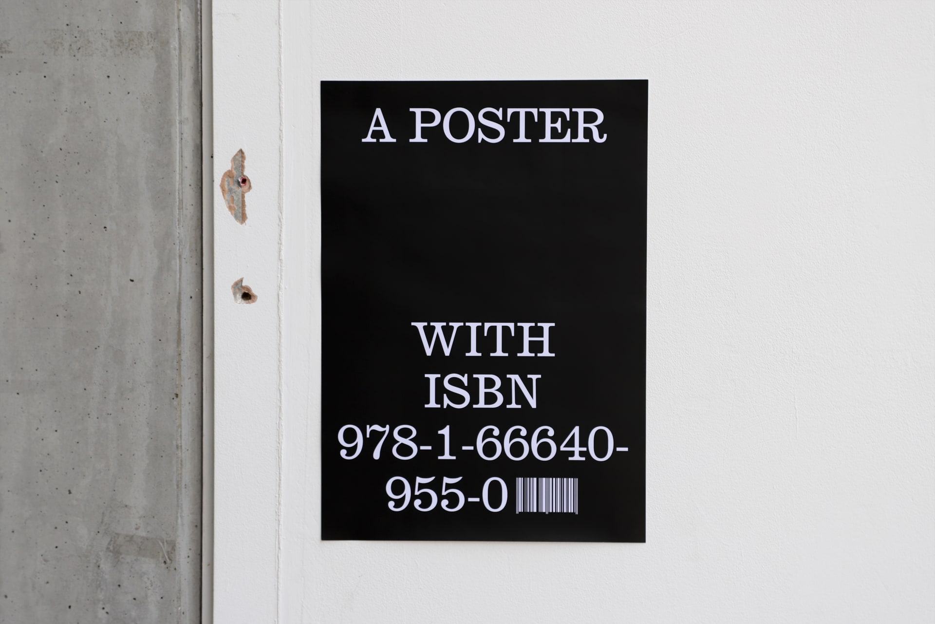 A black poster displays the phrase “A POSTER WITH ISBN” followed by a real ISBN number and barcode, questioning what makes something a book.