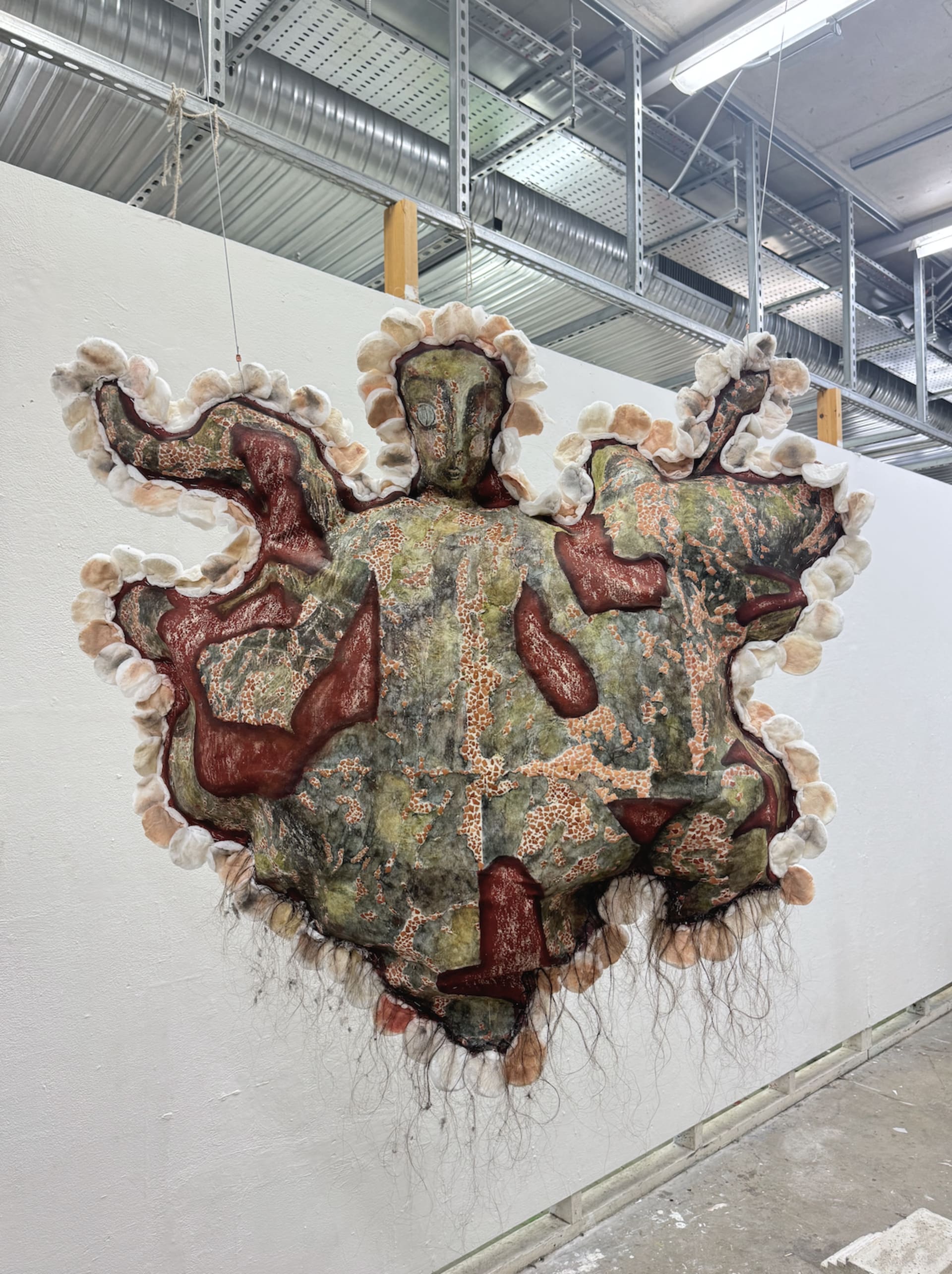 Mixed media installation consisting of an image transfer print, oil pastels, water colour paint, egg shells, collected cotton pads, tangerine skins, f