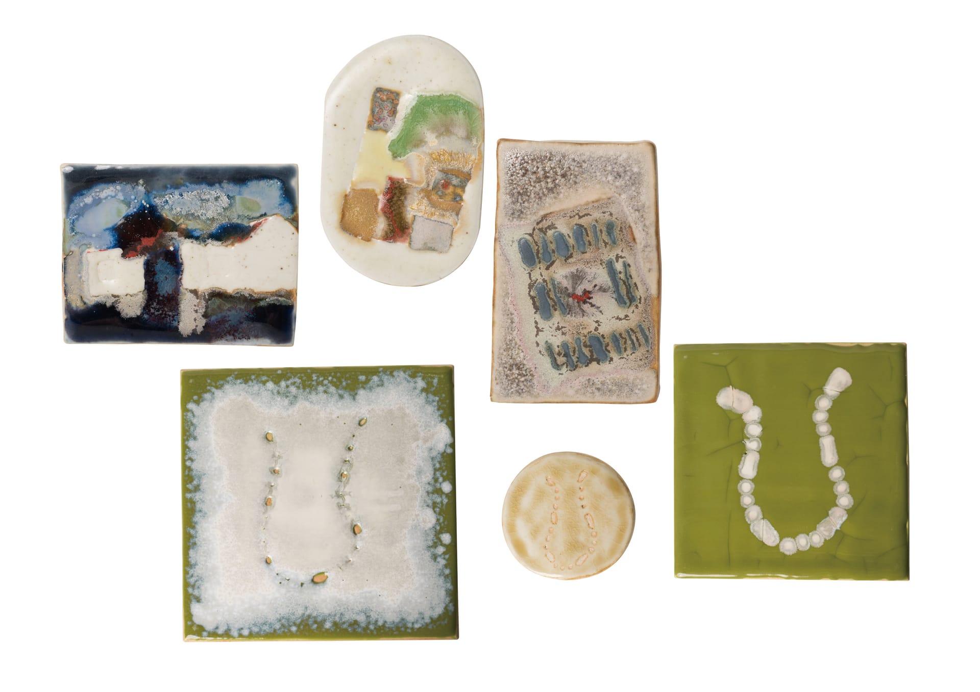 These are glaze painting on ceramic plates with blurry forms transferred from photographs of objects.
