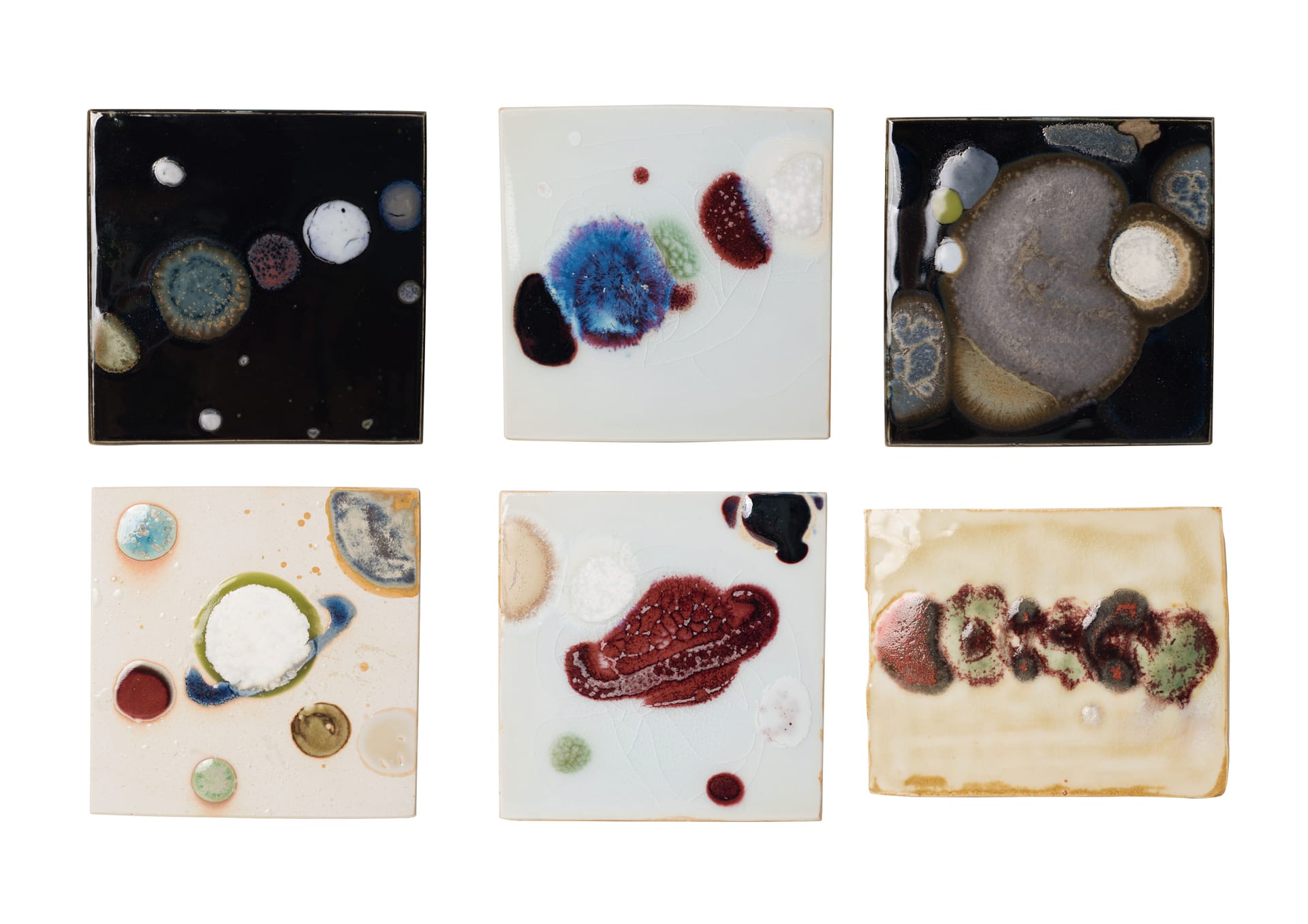 These are glaze painting on ceramic plates with abstract forms of intangible heritage.