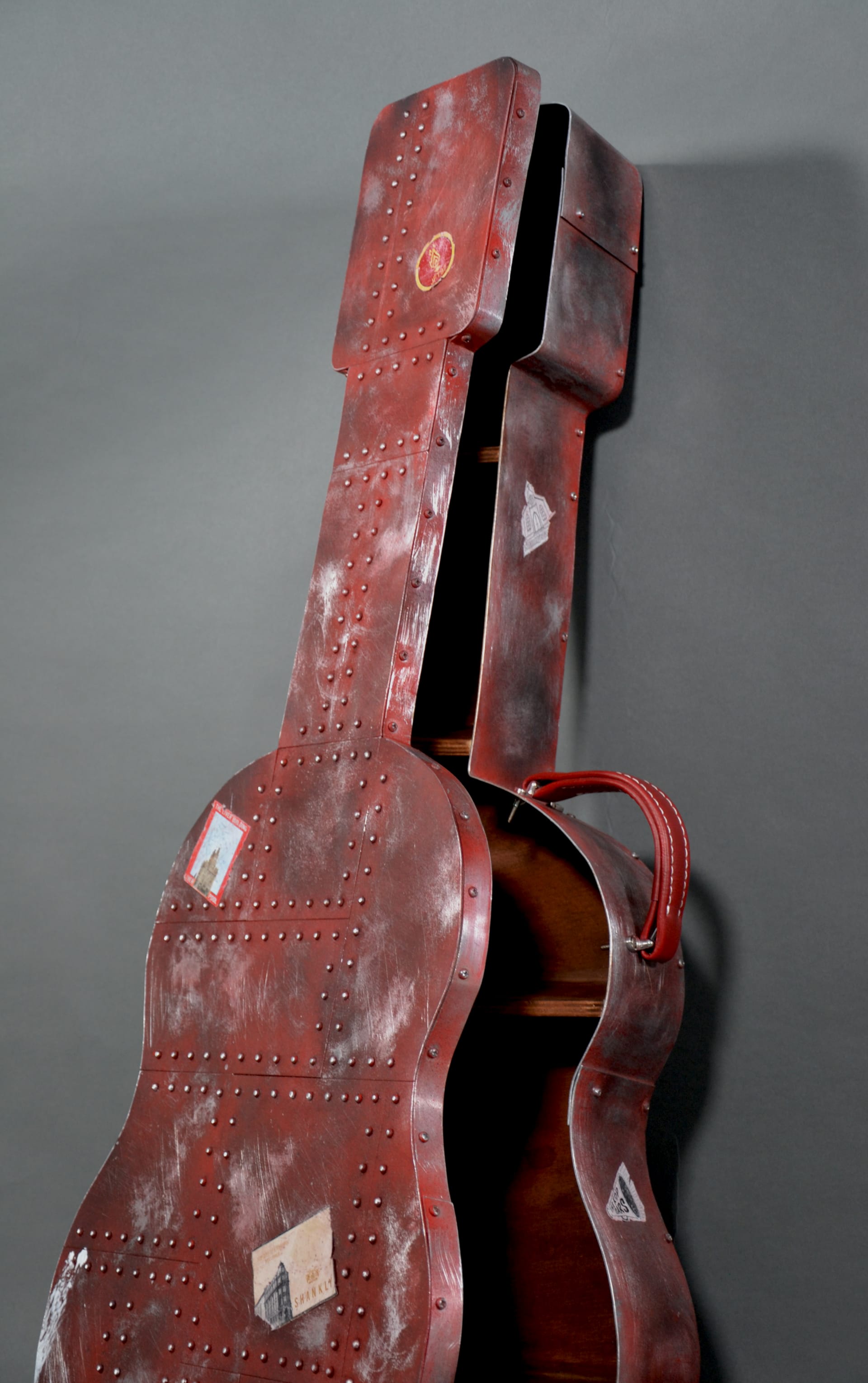 Sculptural furniture piece: industrial, guitar shaped storage unit
