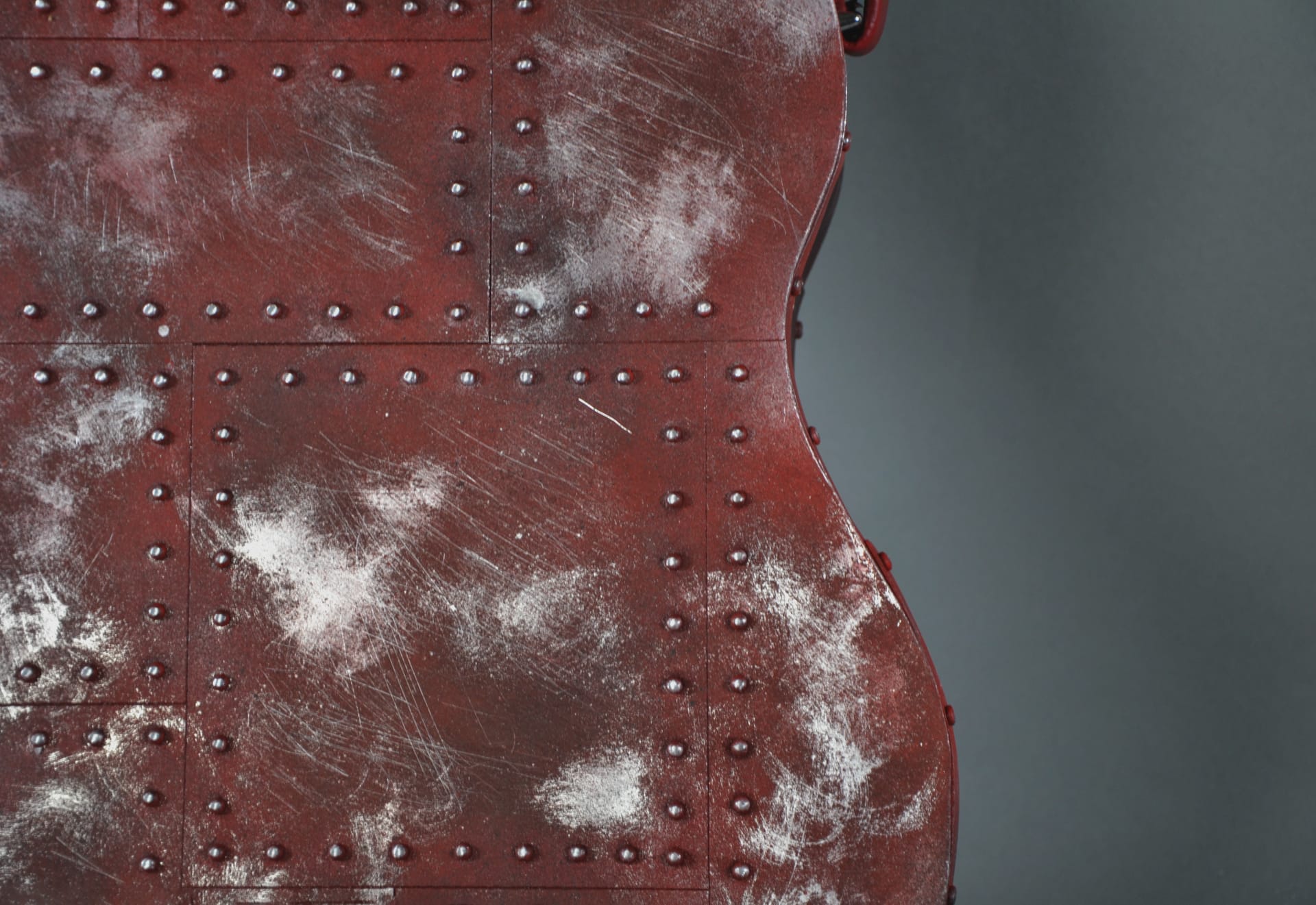Close up of a sculptural furniture piece: industrial, guitar shaped storage unit