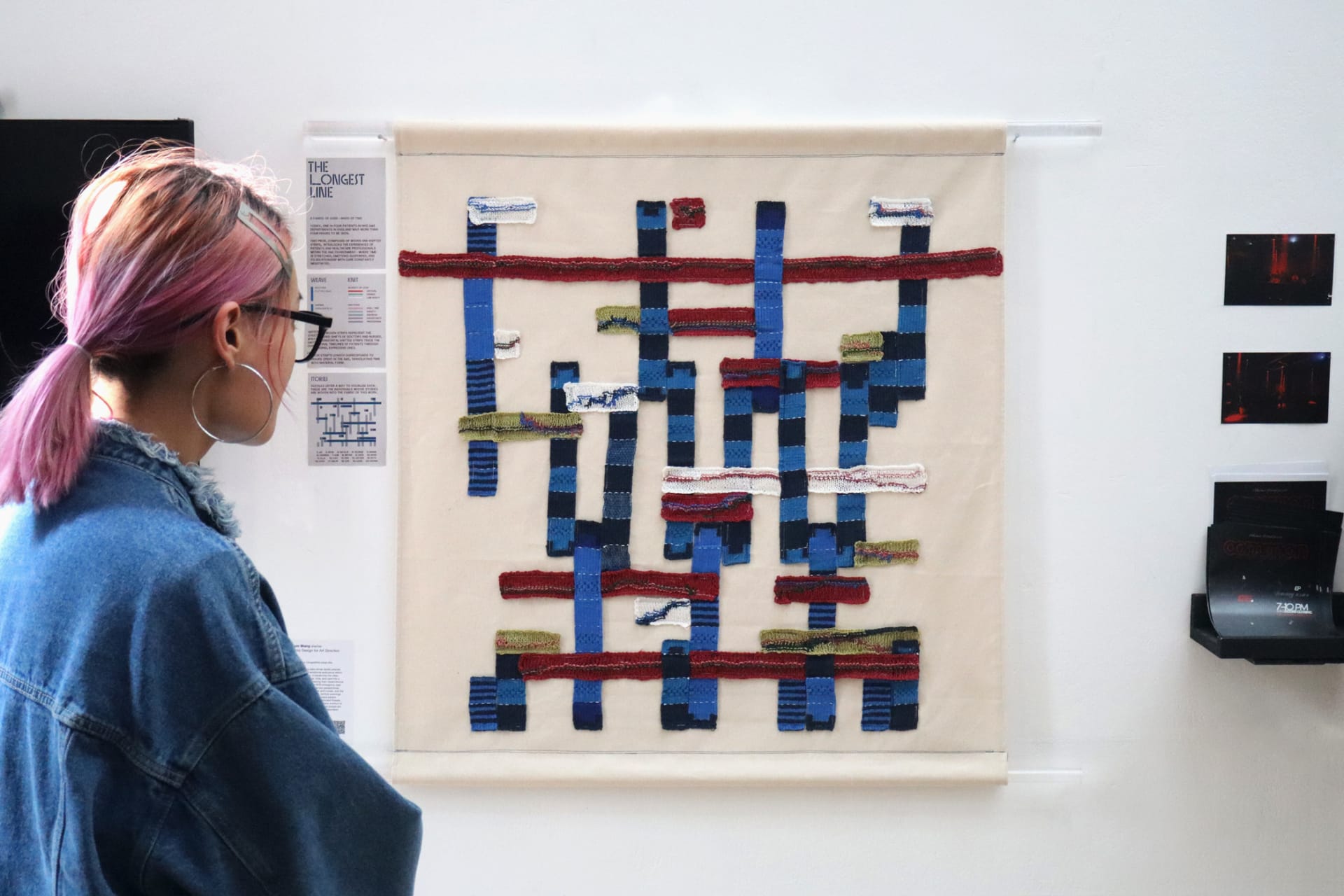 Woman looking at data textile piece