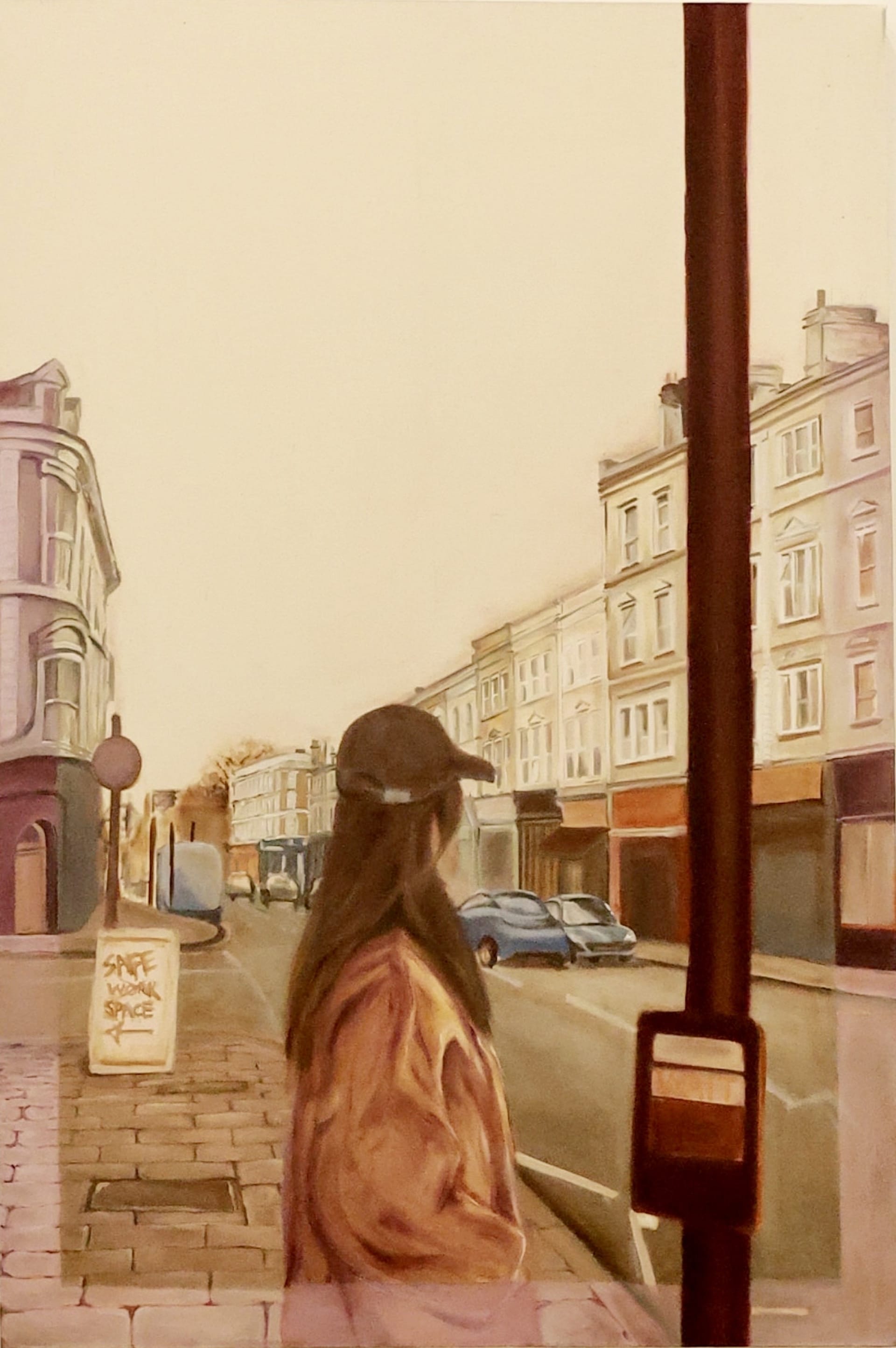 I depict myself wearing a cap and an oversize coat, standing on the pavement with my back to the viewer. 