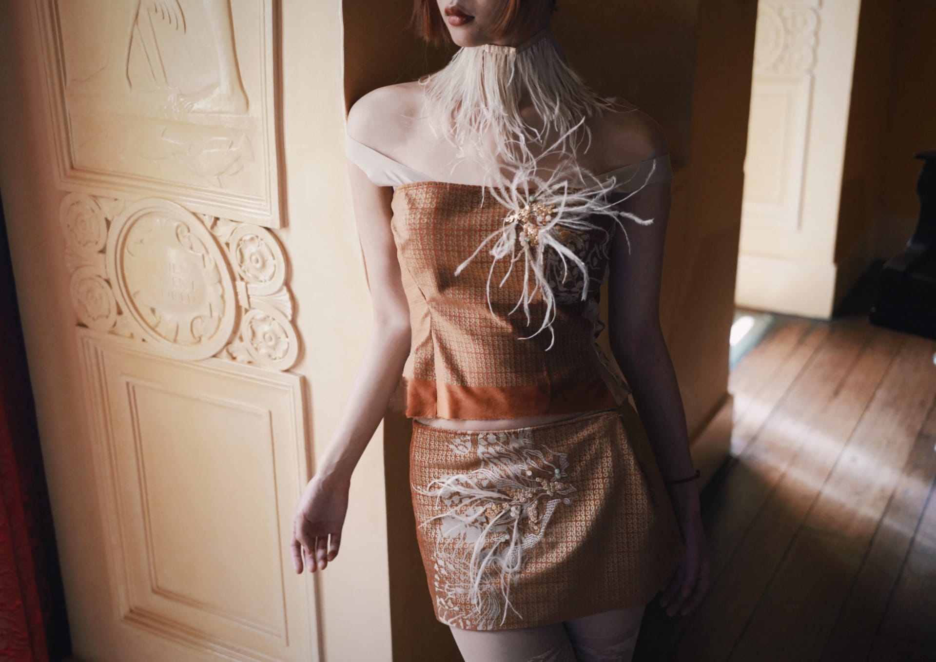 This photo was taken in Eltham Palace. The model was wearing a suit made of sequin print-based fabric, partly with flock butterfly prints, and hand-em