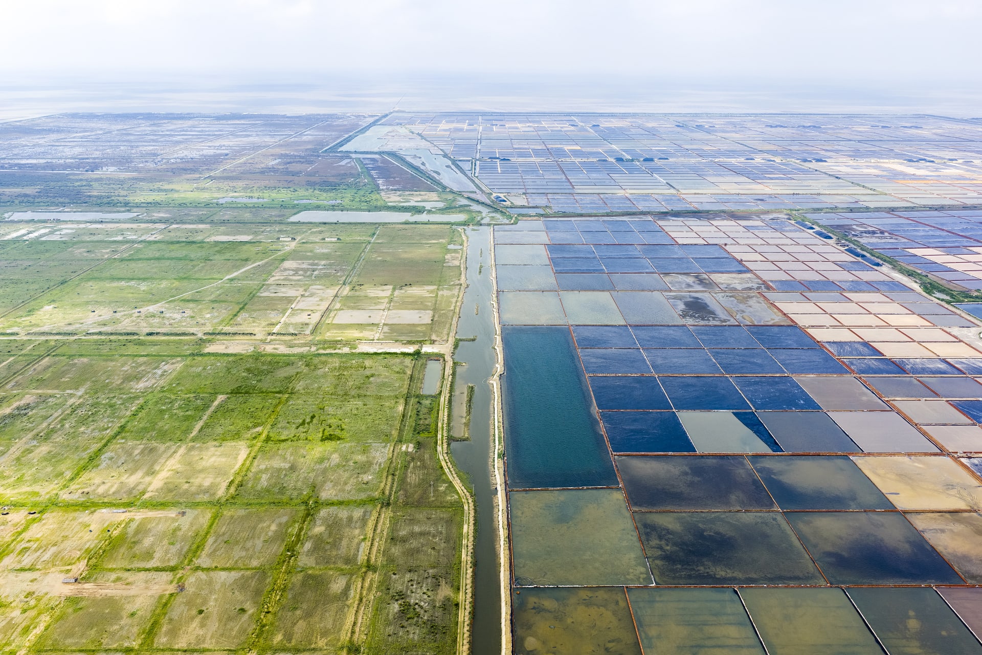 Oblique view of salt fields. Left is grassland yet to be transformed into salt fields.