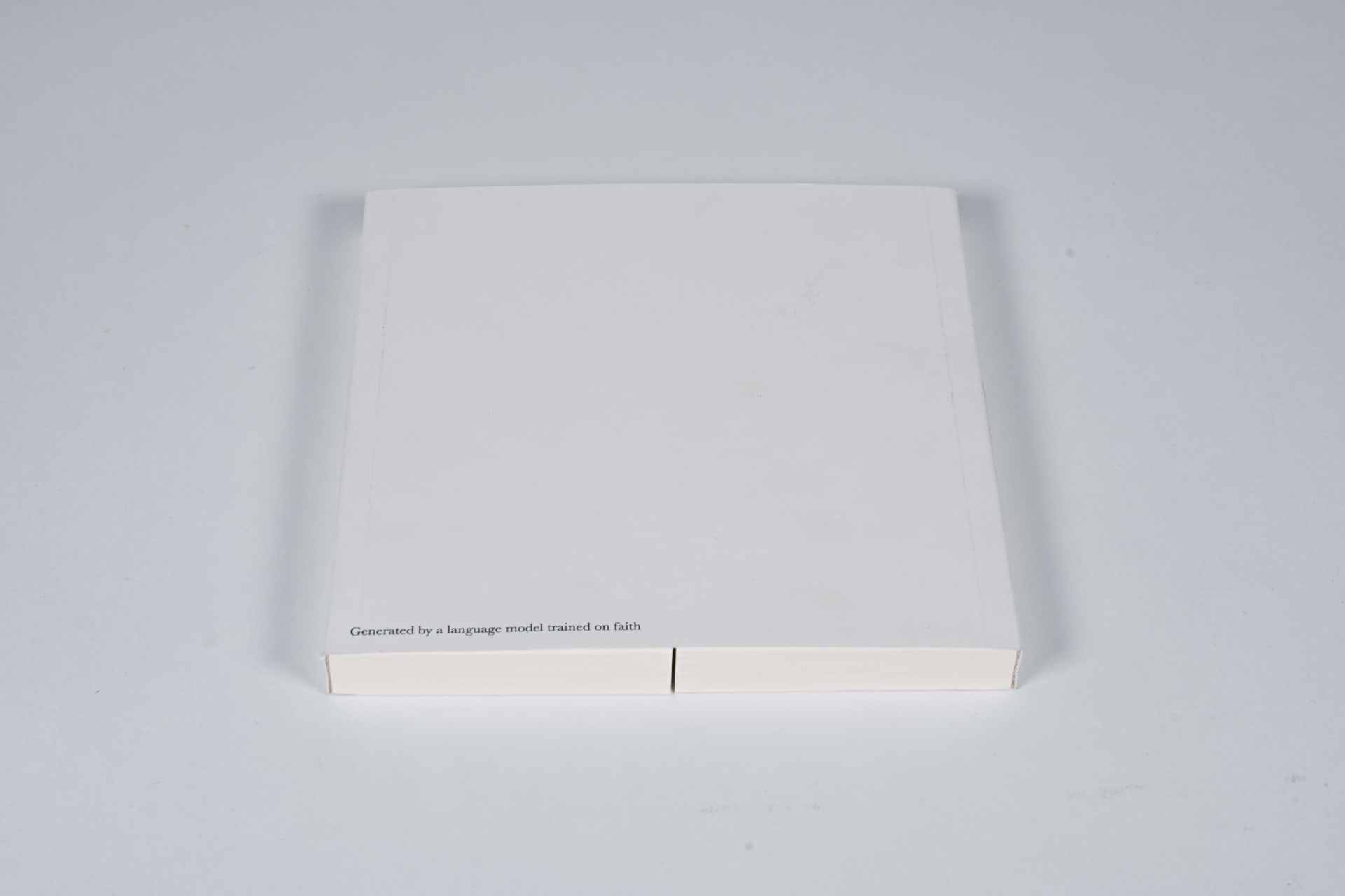 A person opens a white book titled Gate of Fortunes, revealing divination poems printed on both sides.