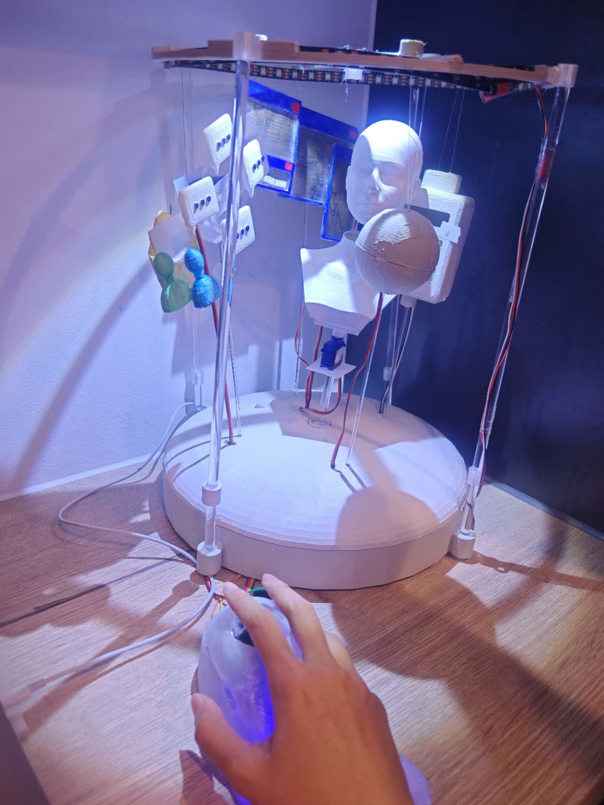White objects suspended within a cylindrical frame. 