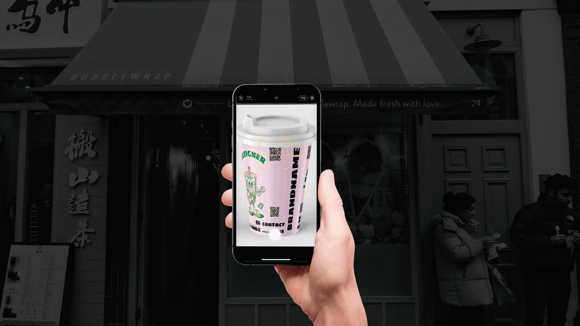 GIF image of an iPhone scanning a bubble tea cup with CV and portfolio QR code displayed